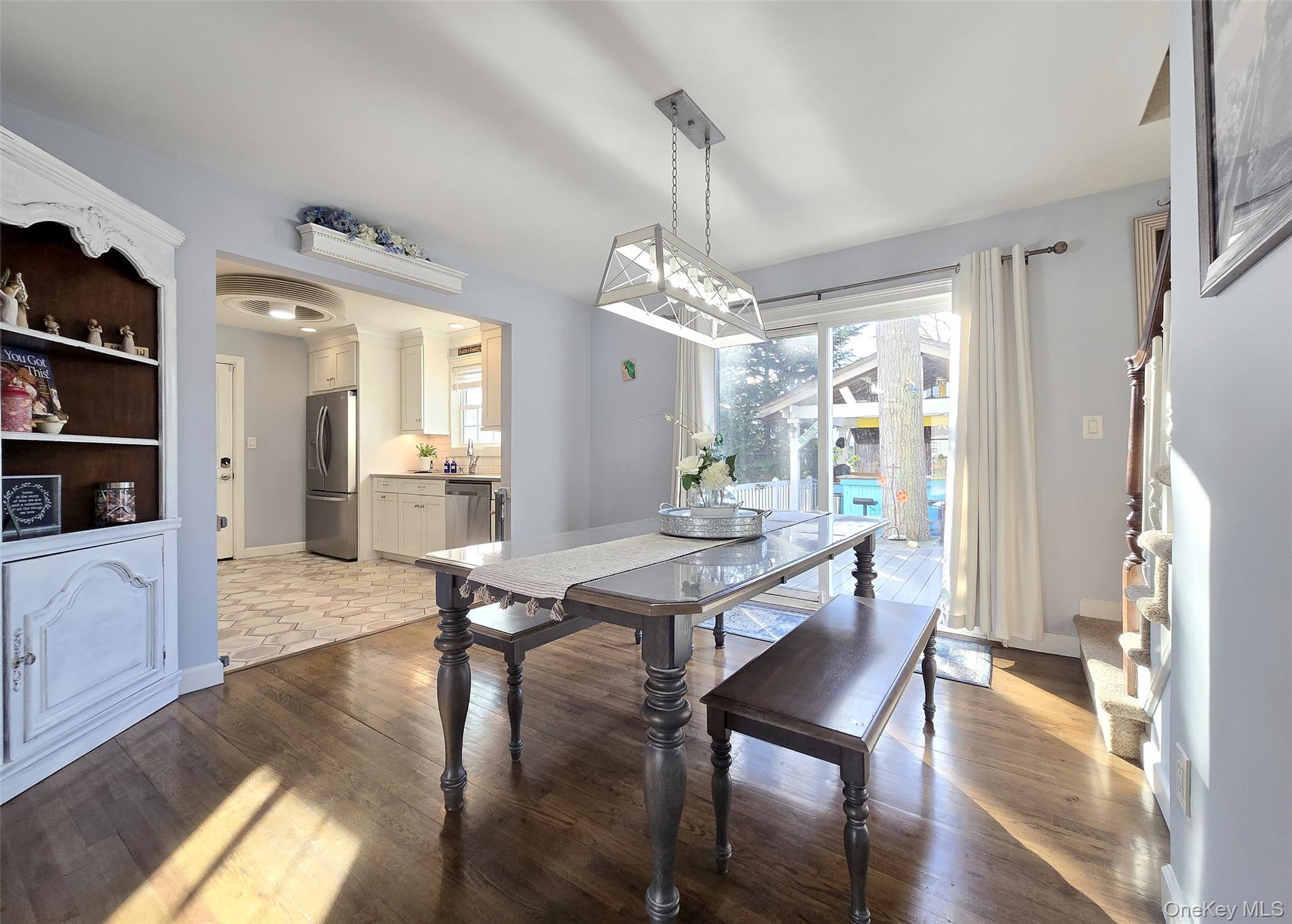 94 Clarendon Road Ronkonkoma, NY 11779 - Photo 5 of 31 a view of a dining room with furniture and wooden floor