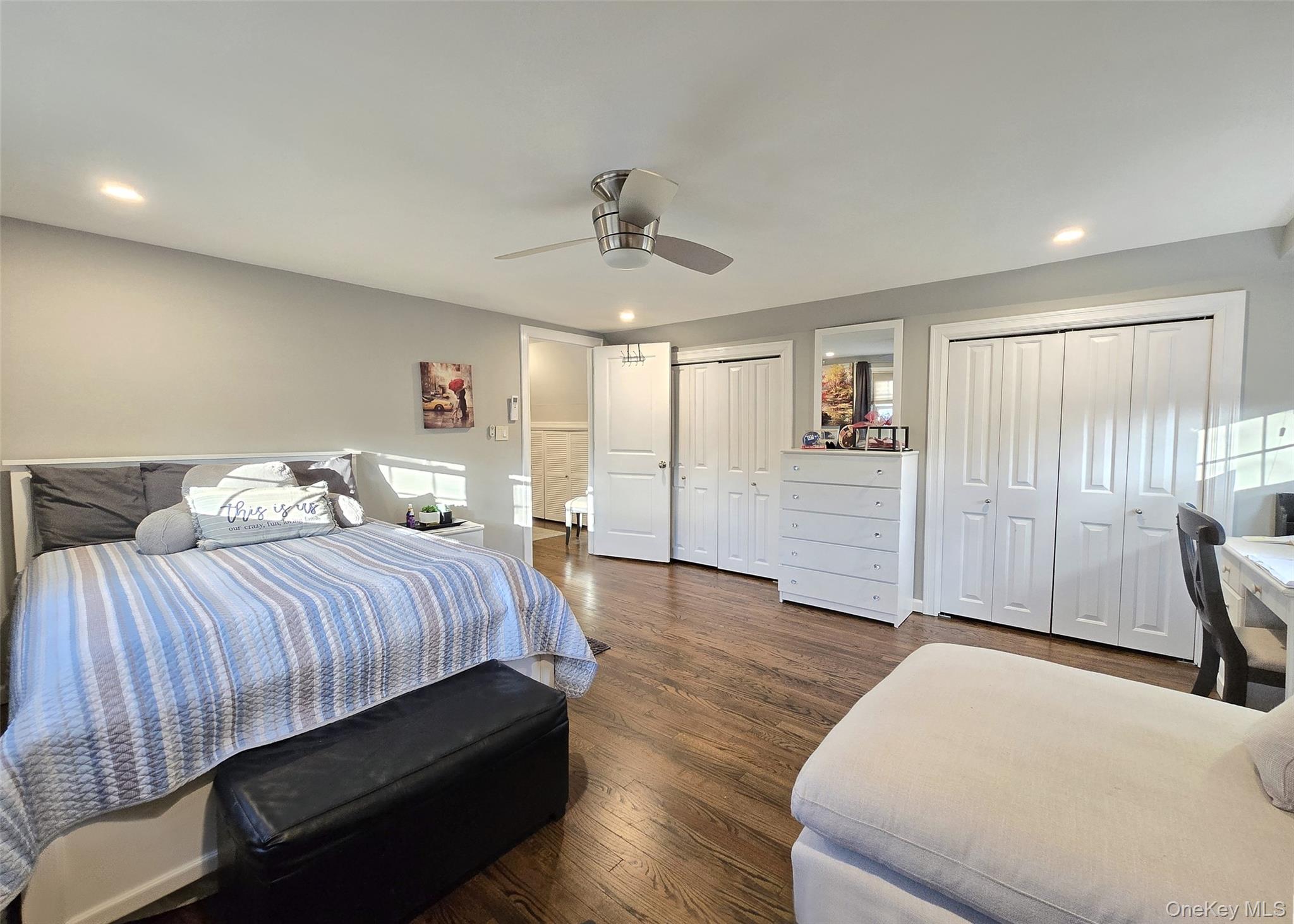 94 Clarendon Road Ronkonkoma, NY 11779 - Photo 10 of 31 a spacious bedroom with a bed and wooden floor