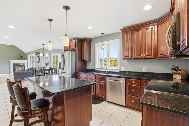 a kitchen with stainless steel appliances granite countertop counter space a sink and cabinets