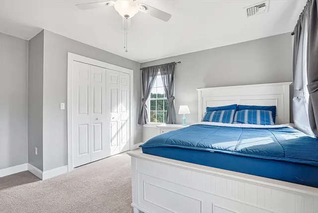 a living room with a fireplace and a window