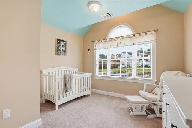 a view of a bedroom with furniture window and outside view