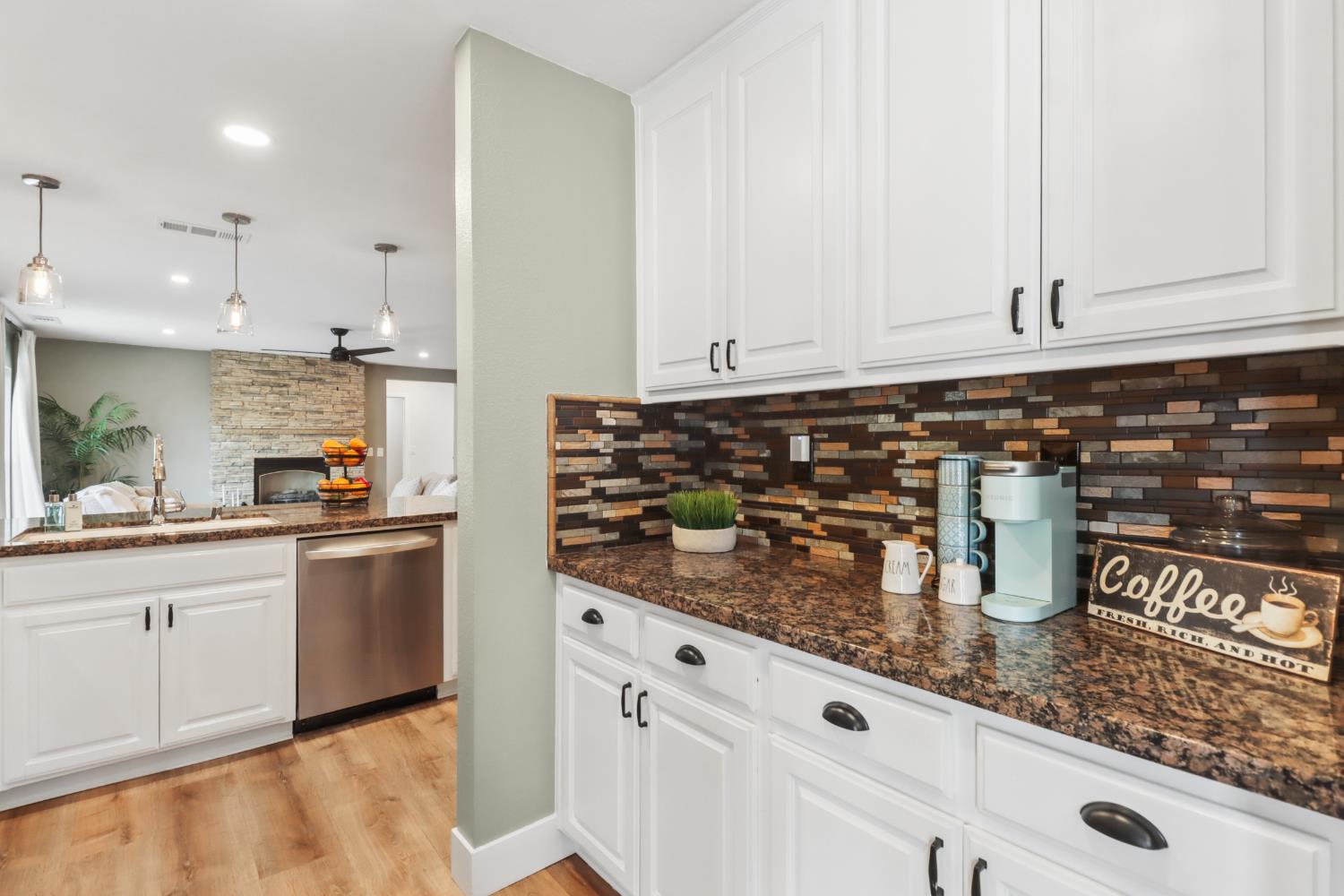 567 I Street Lincoln, CA 95648 - Photo 13 of 53 a kitchen with stainless steel appliances granite countertop a sink and cabinets