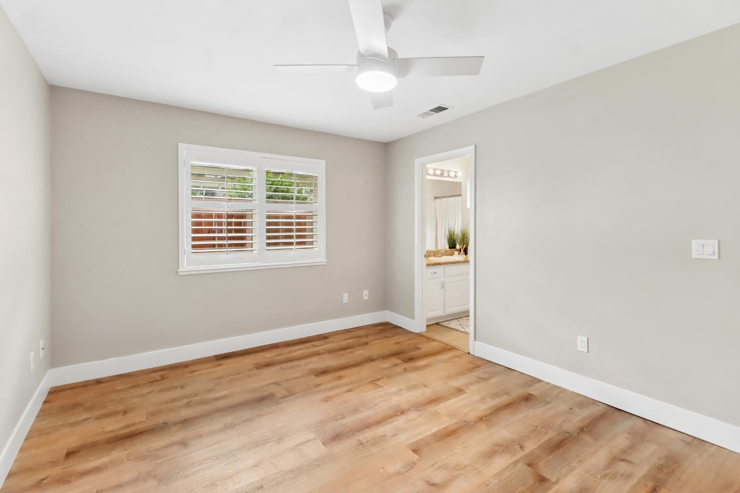 567 I Street Lincoln, CA 95648 - Photo 23 of 53 a view of an empty room with window and wooden floor