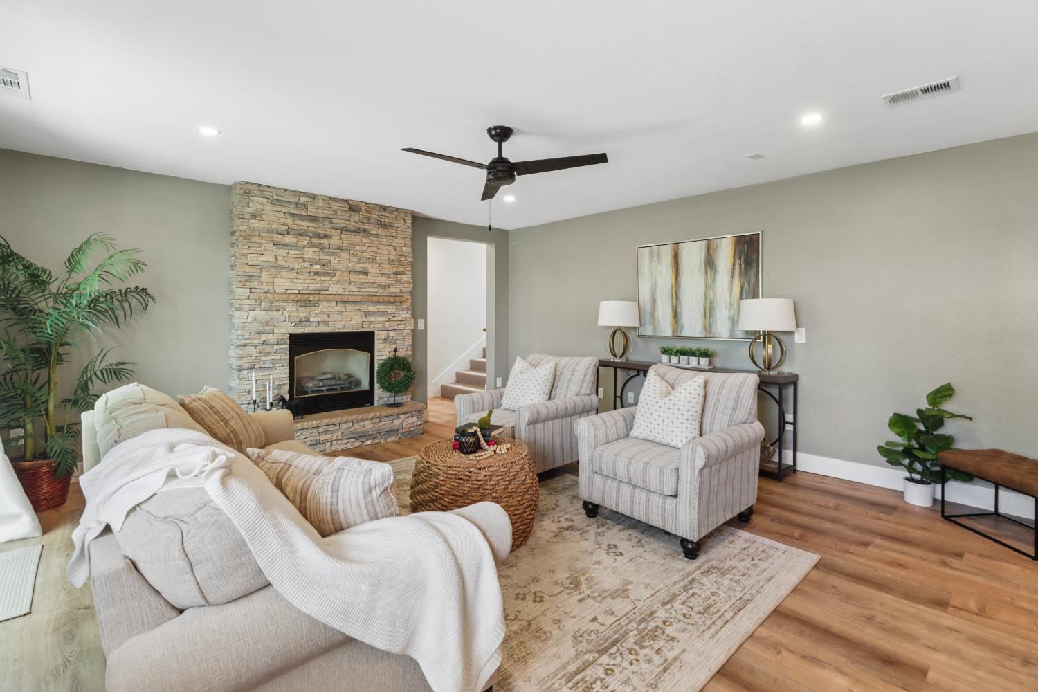 567 I Street Lincoln, CA 95648 - Photo 4 of 53 a living room with furniture and a fireplace