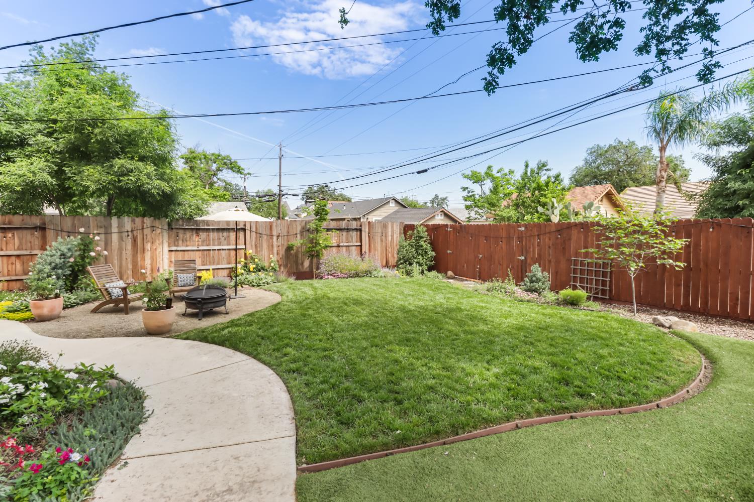 567 I Street Lincoln, CA 95648 - Photo 49 of 53 a view of a backyard with table and chairs and potted plants