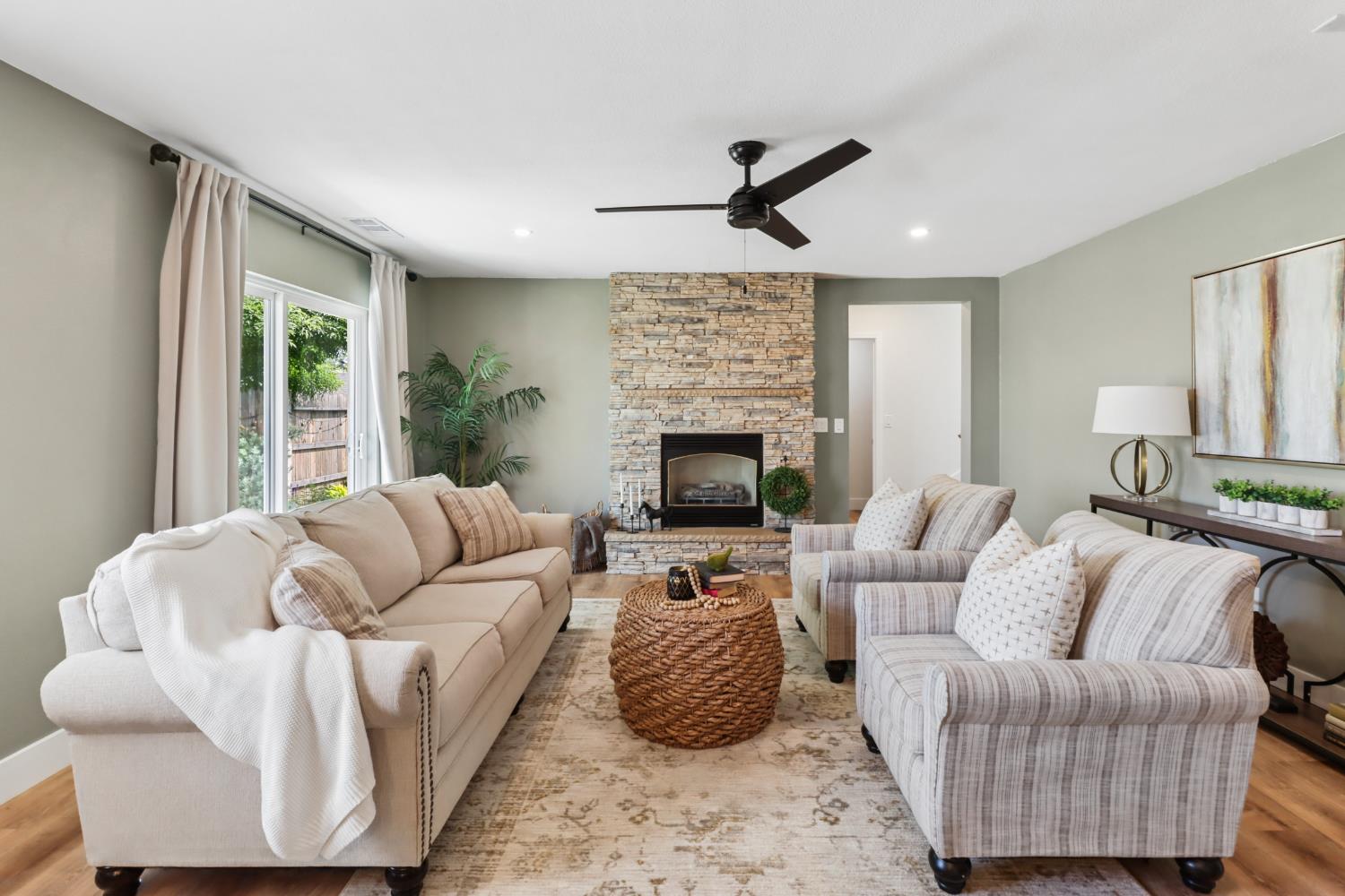 567 I Street Lincoln, CA 95648 - Photo 7 of 53 a living room with furniture fireplace and a large window