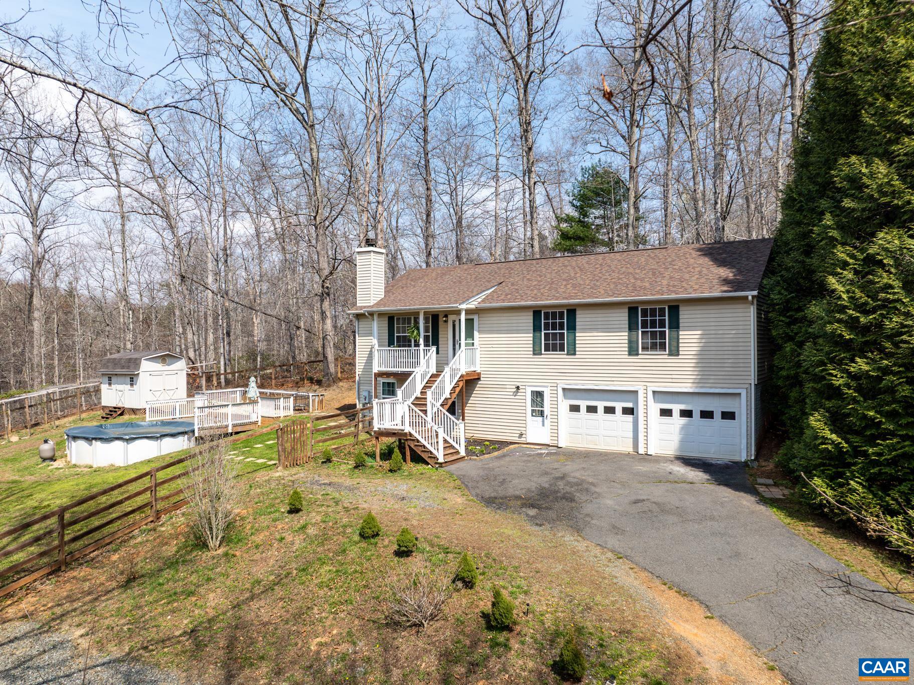 1029 West Daffodil Road Ruckersville, VA 22968 - Photo 5 of 39 a view of a house with swimming pool and sitting area