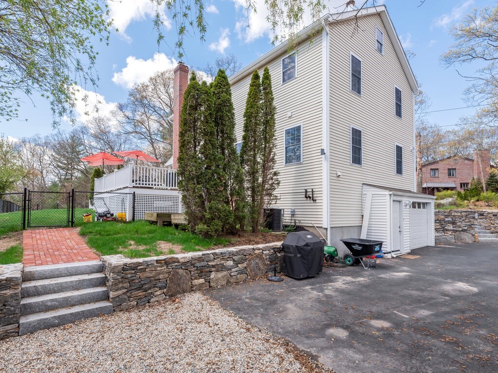 50 Sawmill Road Dudley, MA 01571 - Photo 14 of 40 a white house with a small yard and large trees