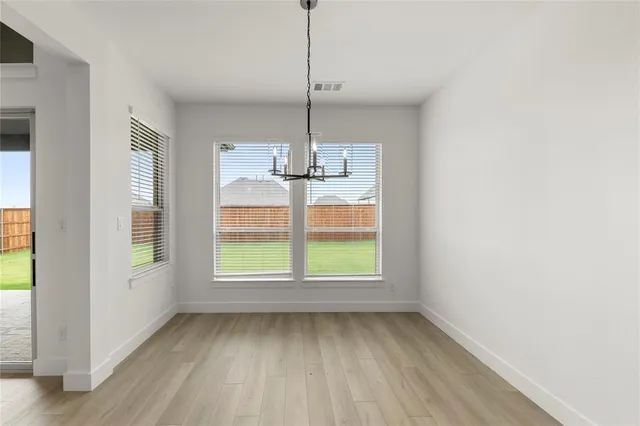 a kitchen with granite countertop a stove and a refrigerator