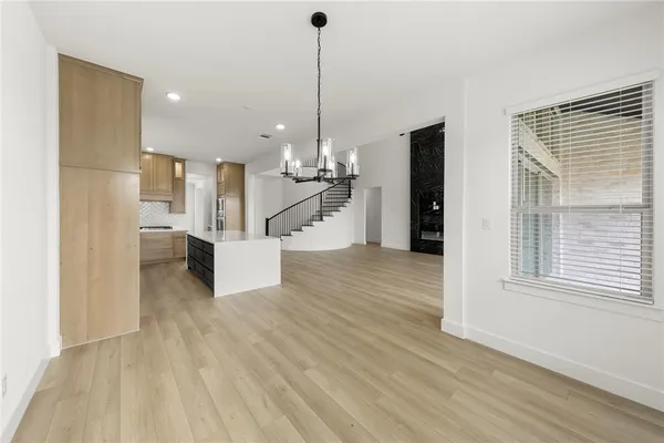 a view of a room with window wooden floor and windows