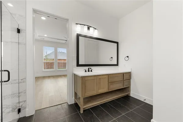 a bathroom with a sink tub and a mirror