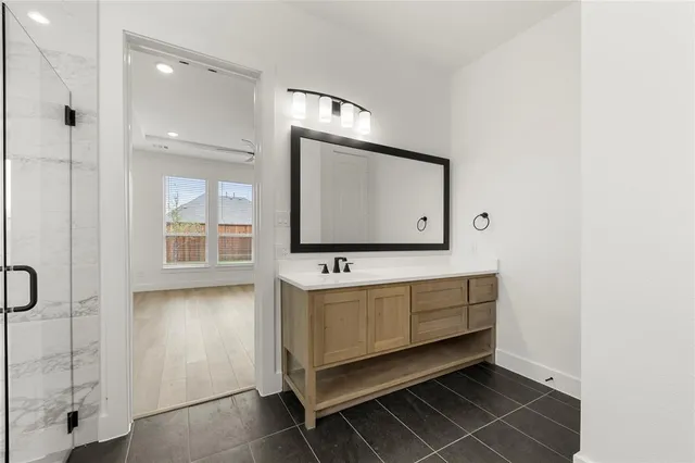 a bathroom with a sink tub and a mirror
