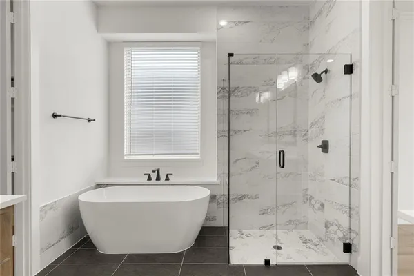 a bathroom with a sink a mirror and shower