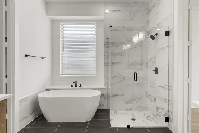 a bathroom with a sink a mirror and shower