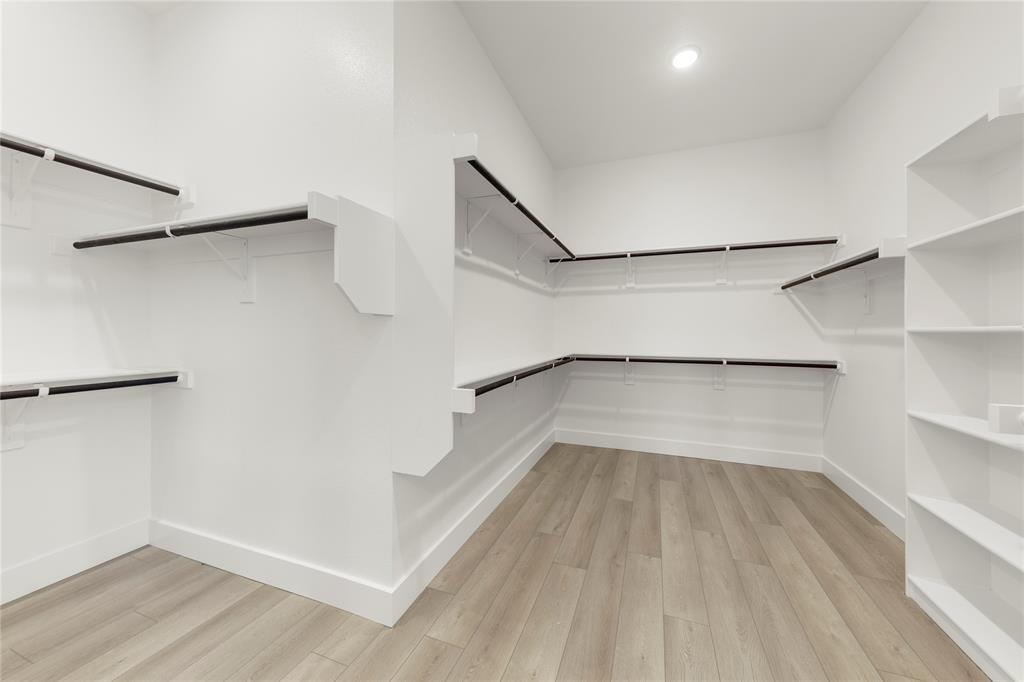 981 Georgetown Place Prosper, TX 75078 - Photo 21 of 30 a view of walk in closet with empty racks