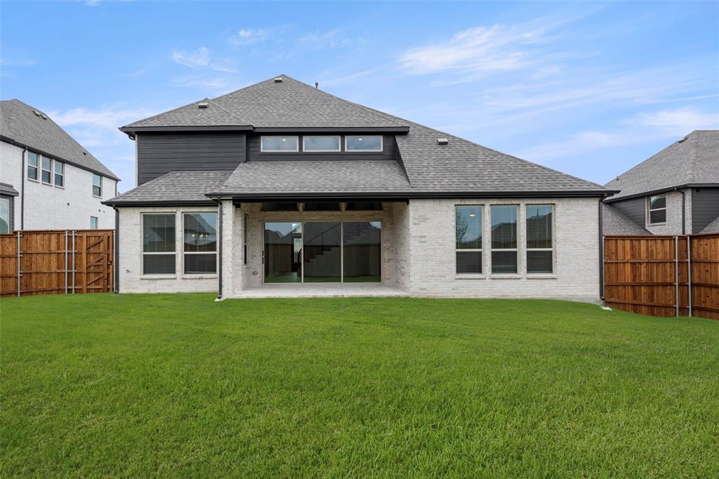 981 Georgetown Place Prosper, TX 75078 - Photo 27 of 30 a front view of a house with a yard