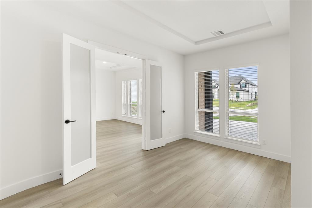 981 Georgetown Place Prosper, TX 75078 - Photo 4 of 30 wooden floor in an empty room