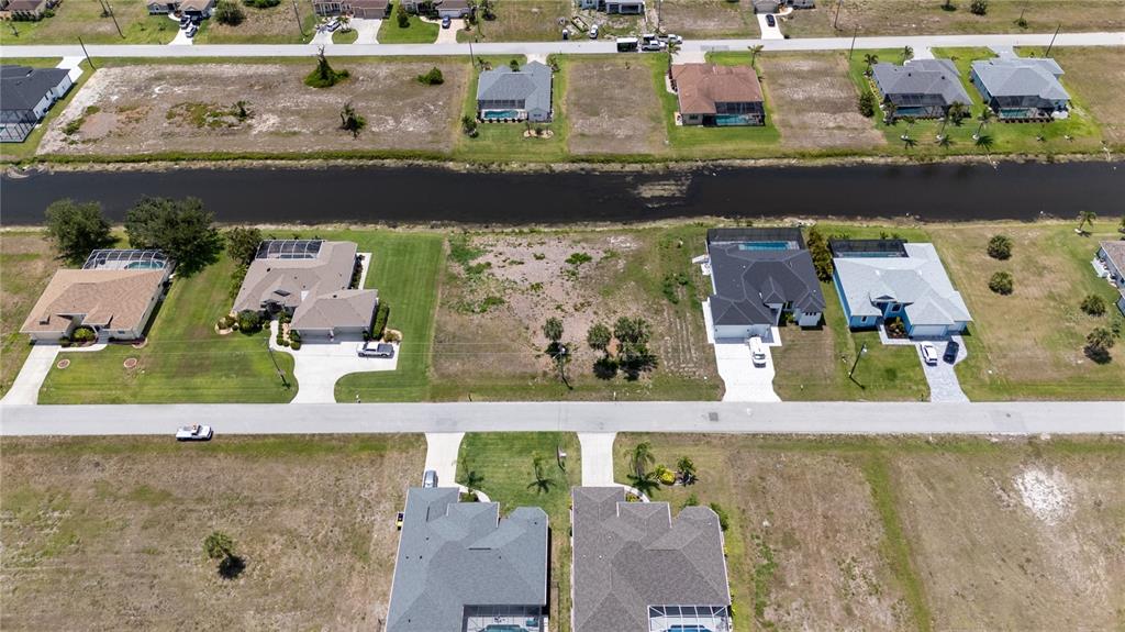227 Tournament Road Rotonda West, FL 33947 - Photo 2 of 7 an aerial view of a house with a swimming pool
