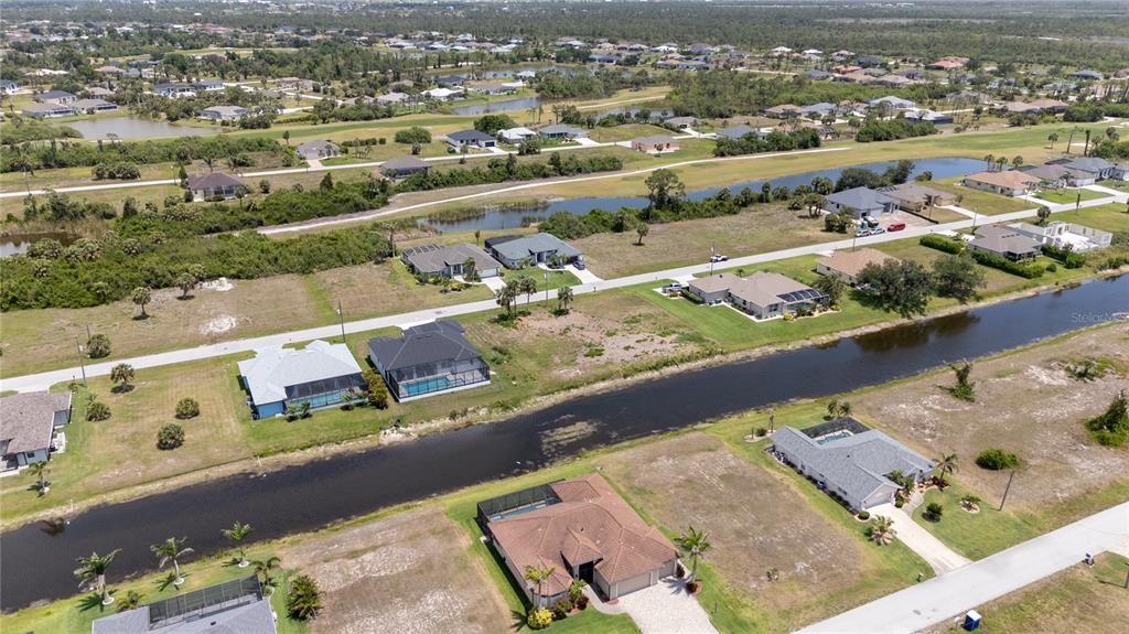 227 Tournament Road Rotonda West, FL 33947 - Photo 5 of 7 an aerial view of residential houses with outdoor space