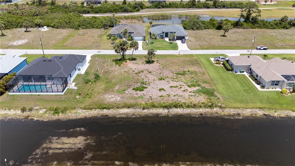 227 Tournament Road Rotonda West, FL 33947 - Photo 6 of 7 an aerial view of a house with a lake view
