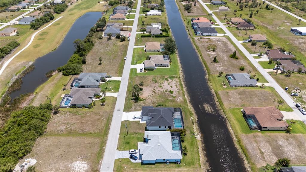 227 Tournament Road Rotonda West, FL 33947 - Photo 7 of 7 an aerial view of residential houses with outdoor space