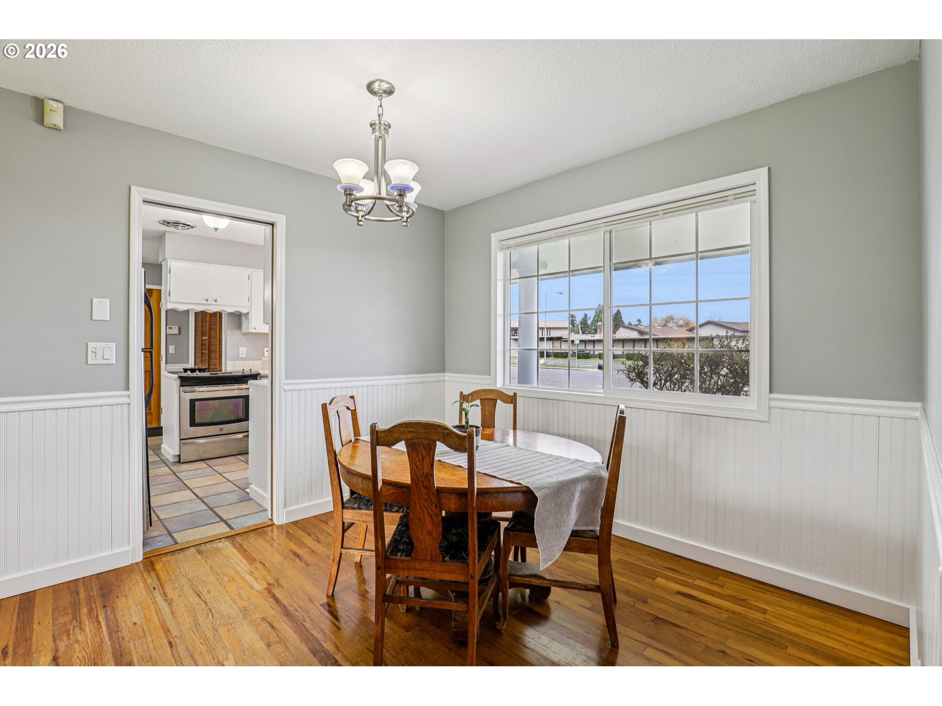 155 Sunset Boulevard St. Helens, OR 97051 - Photo 14 of 44 a dining room with furniture a window and wooden floor