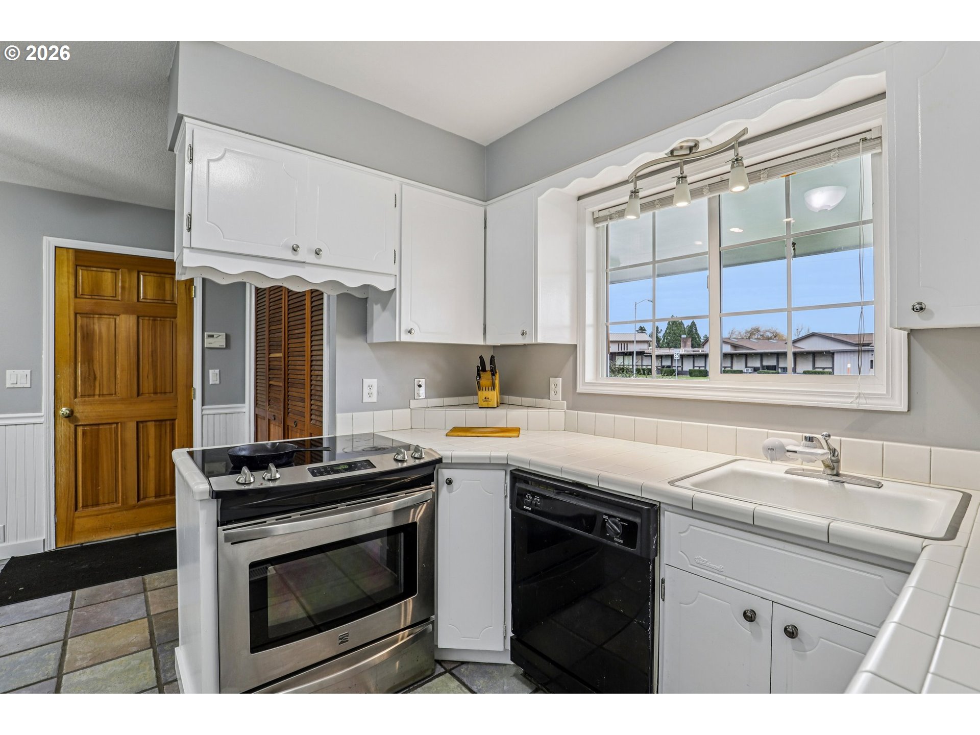 155 Sunset Boulevard St. Helens, OR 97051 - Photo 15 of 44 a kitchen with stainless steel appliances a stove sink and cabinets