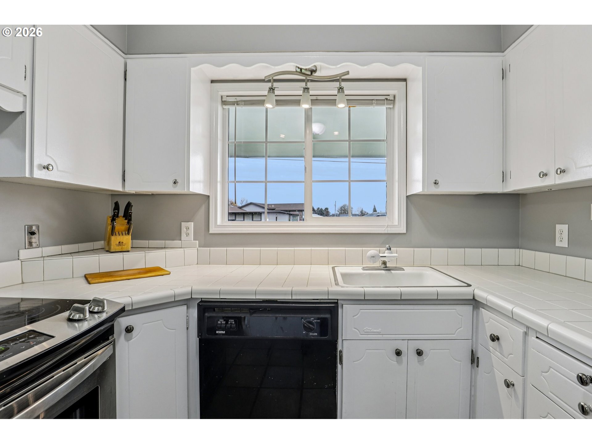 155 Sunset Boulevard St. Helens, OR 97051 - Photo 16 of 44 a kitchen with a sink stove and cabinets