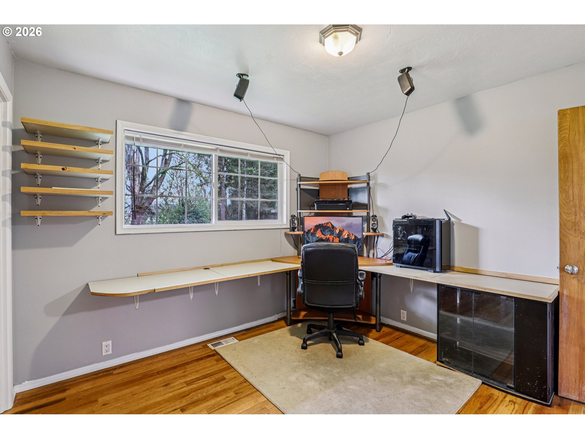 155 Sunset Boulevard St. Helens, OR 97051 - Photo 21 of 44 a work room with furniture a rug and a window