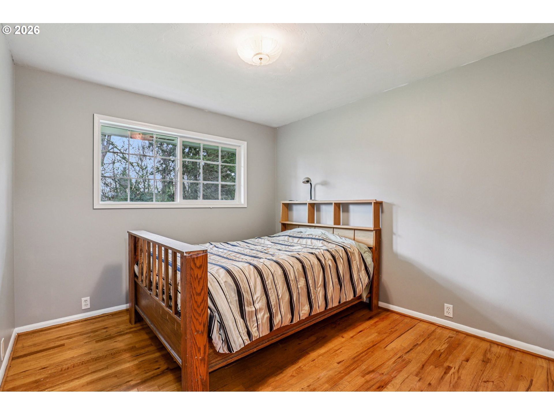 155 Sunset Boulevard St. Helens, OR 97051 - Photo 26 of 44 a bedroom with a bed and window