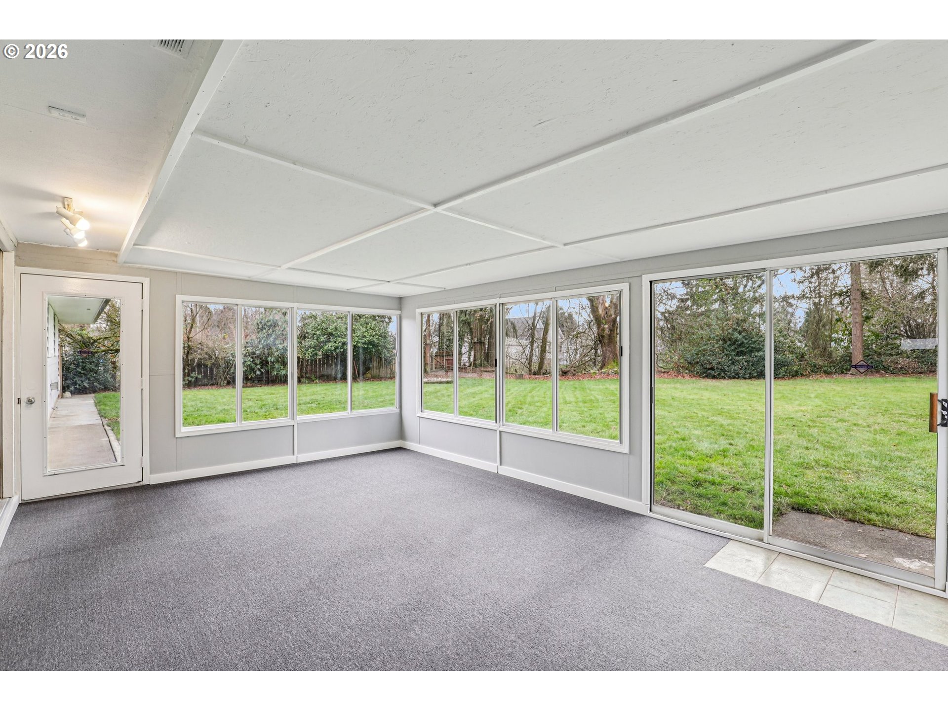155 Sunset Boulevard St. Helens, OR 97051 - Photo 35 of 44 a view of an empty room with wooden floor and door