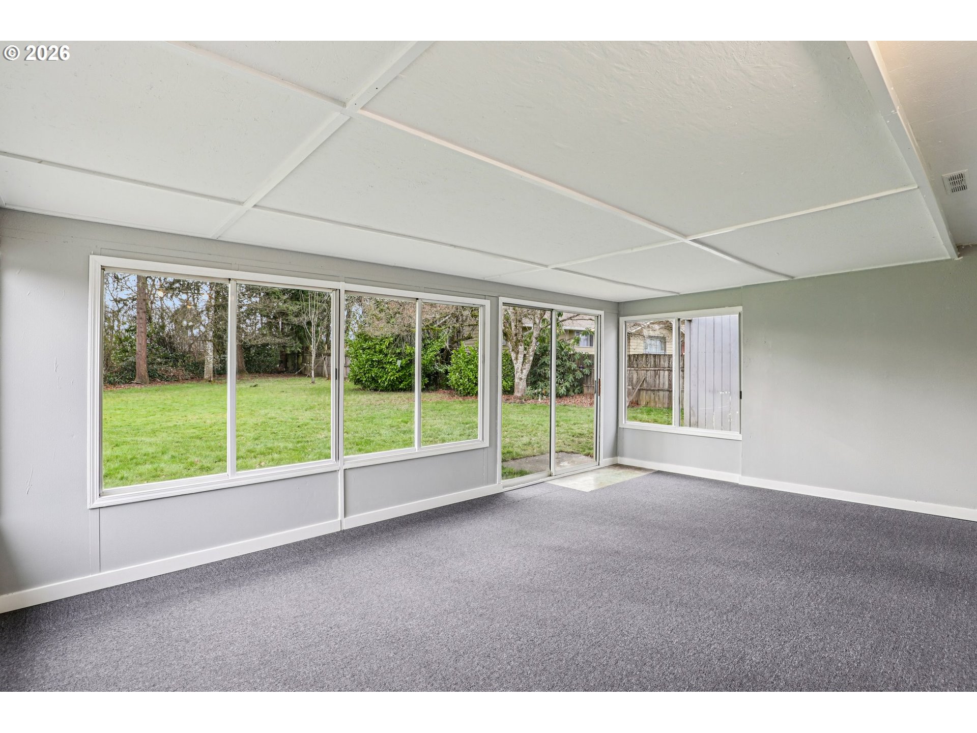 155 Sunset Boulevard St. Helens, OR 97051 - Photo 37 of 44 a view of an empty room with wooden floor and iron fence