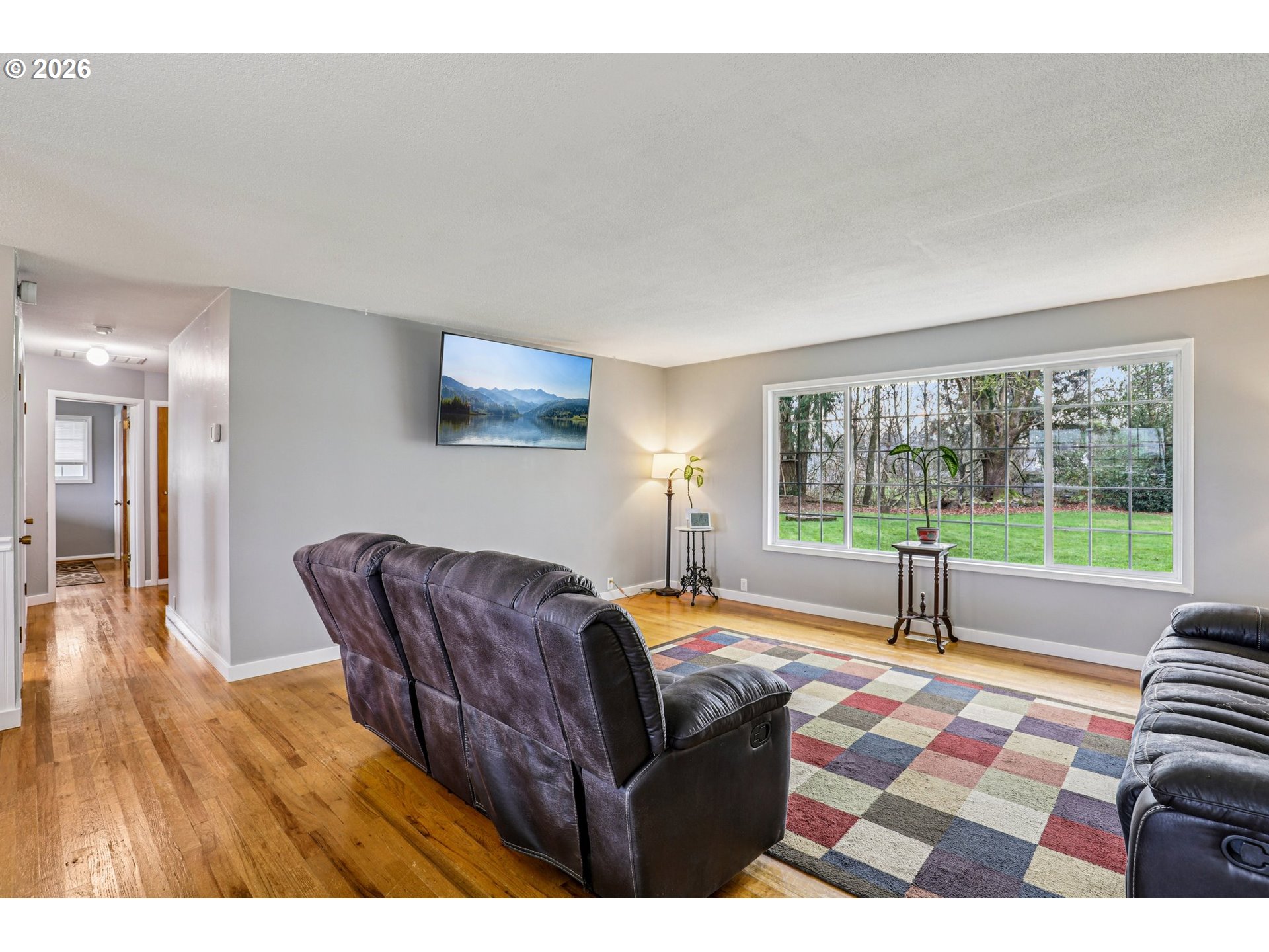 155 Sunset Boulevard St. Helens, OR 97051 - Photo 10 of 44 a living room with furniture and a floor to ceiling window
