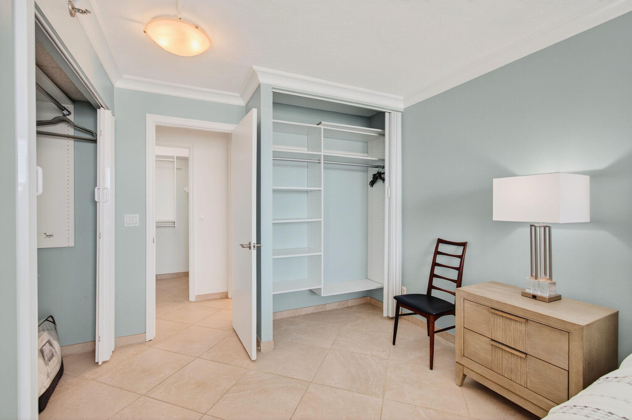 4511 South Ocean Boulevard, Unit 1004 Highland Beach, FL 33487 - Photo 19 of 76 a view of a livingroom with furniture and a lamp