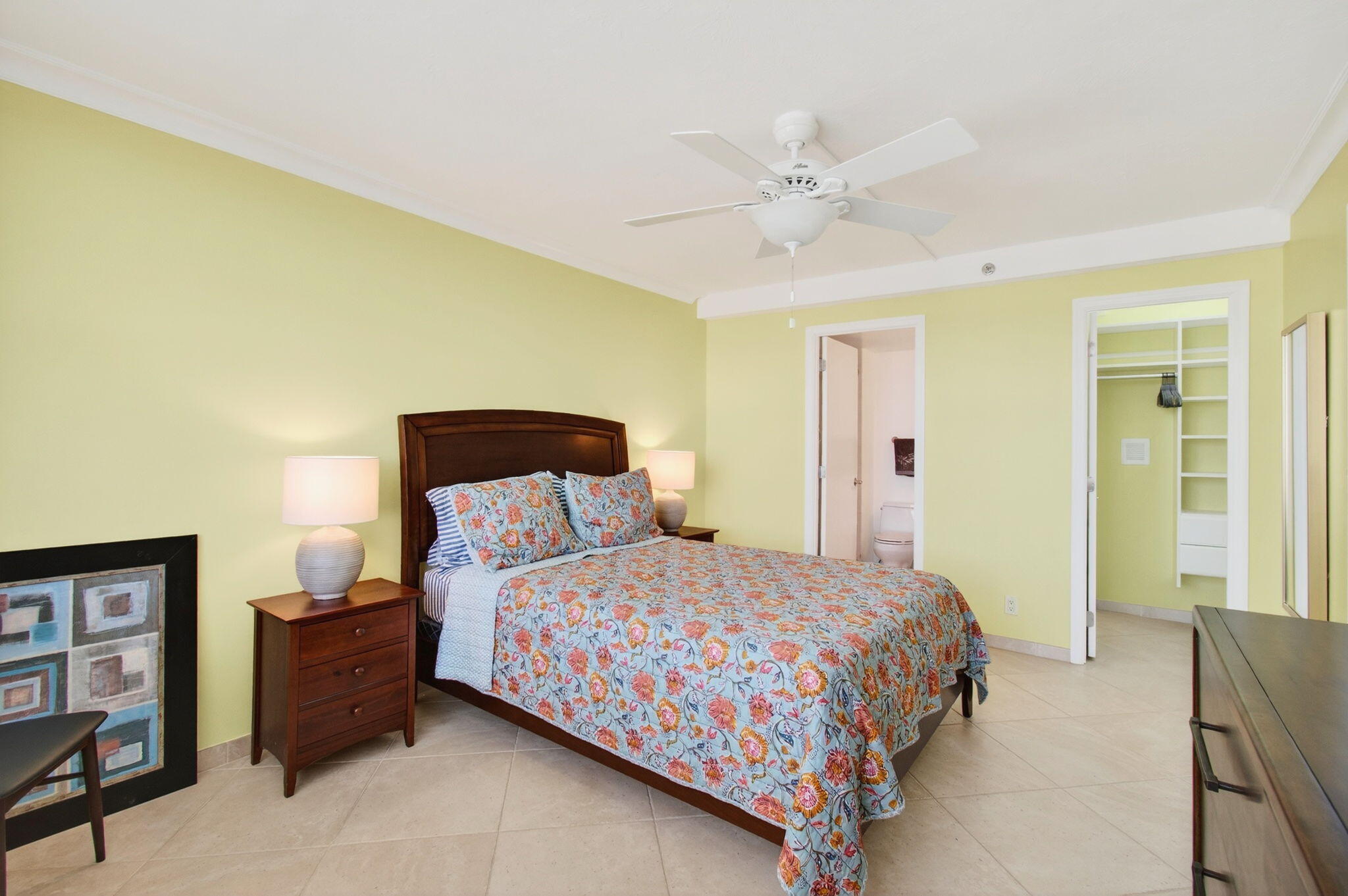 4511 South Ocean Boulevard, Unit 1004 Highland Beach, FL 33487 - Photo 28 of 76 a bedroom with a bed and a chandelier