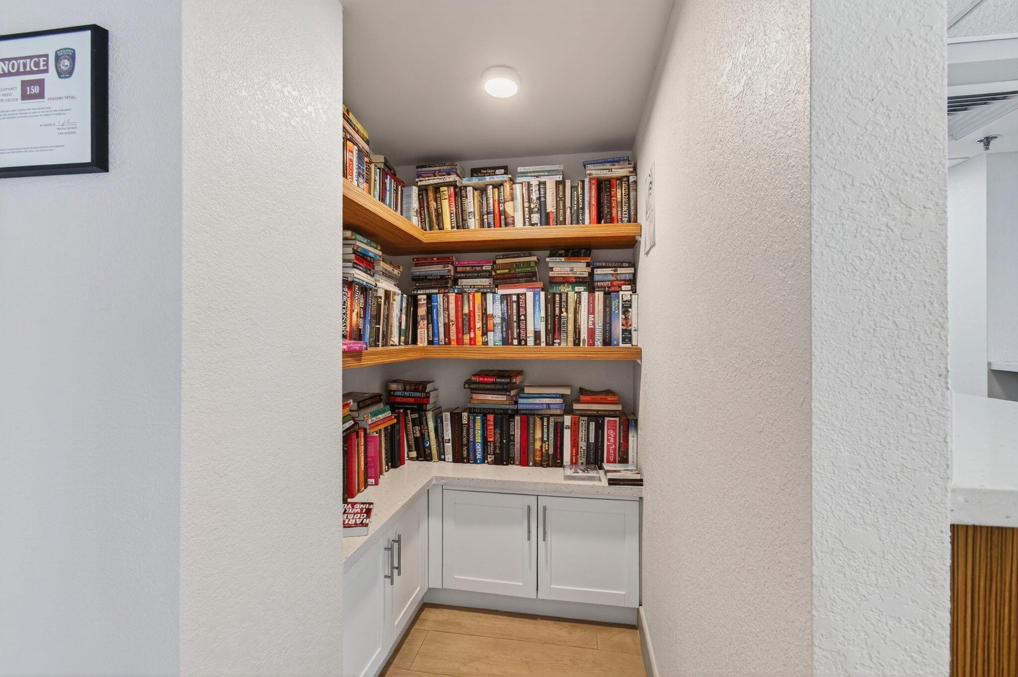 4511 South Ocean Boulevard, Unit 1004 Highland Beach, FL 33487 - Photo 60 of 76 a view of a book shelf with lots of books