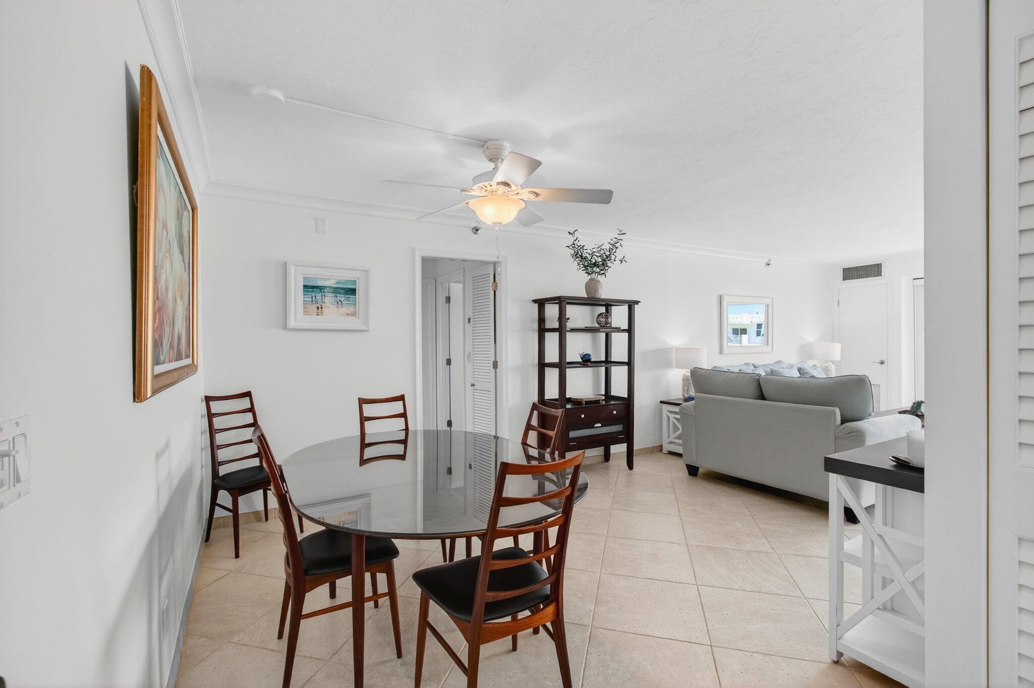 4511 South Ocean Boulevard, Unit 1004 Highland Beach, FL 33487 - Photo 7 of 76 a view of a dining room with furniture and a chandelier