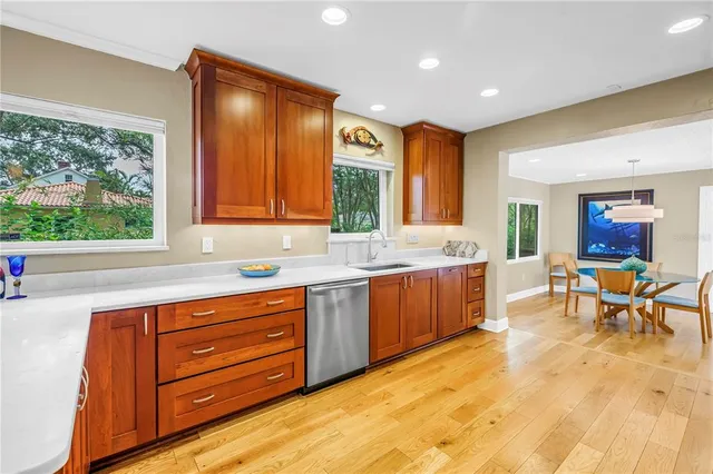 a kitchen with stainless steel appliances granite countertop a refrigerator stove and oven