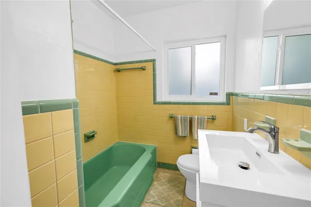 a view of a room with wooden floor and windows