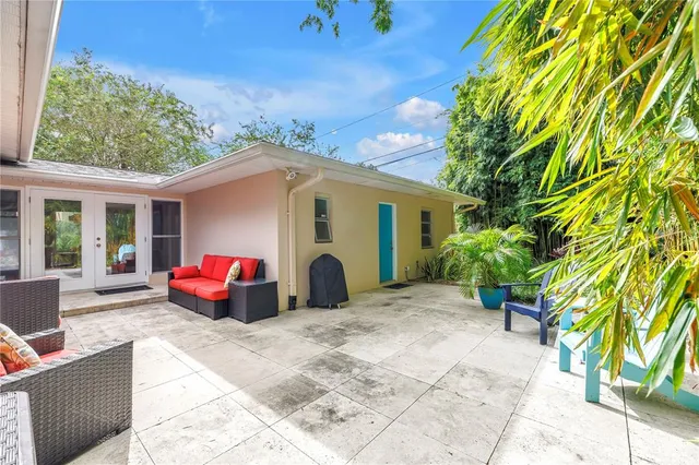 a backyard of a house with seating space