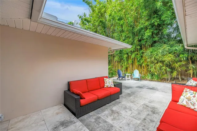 a green field with lots of trees in it