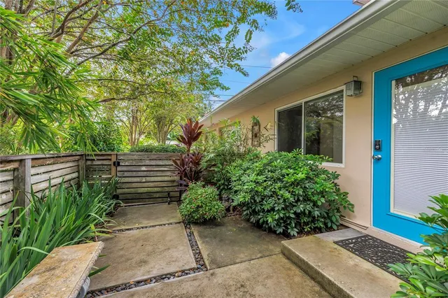 a front view of a house with a yard and a garage