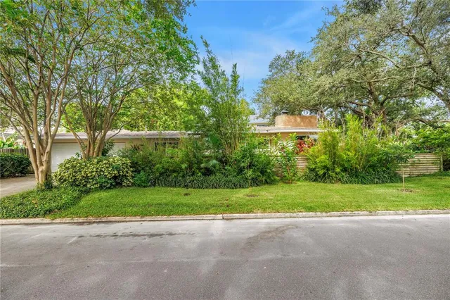 a view of a lake with houses in the background