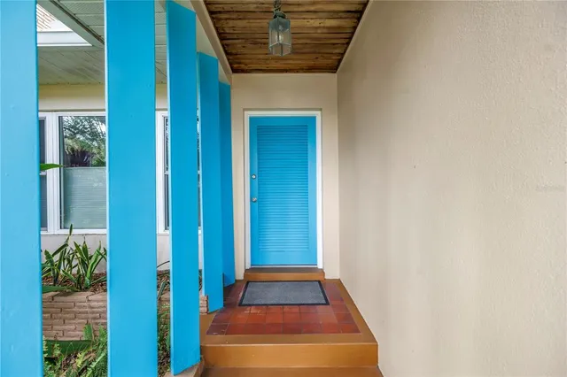 a living room with furniture a rug and a window