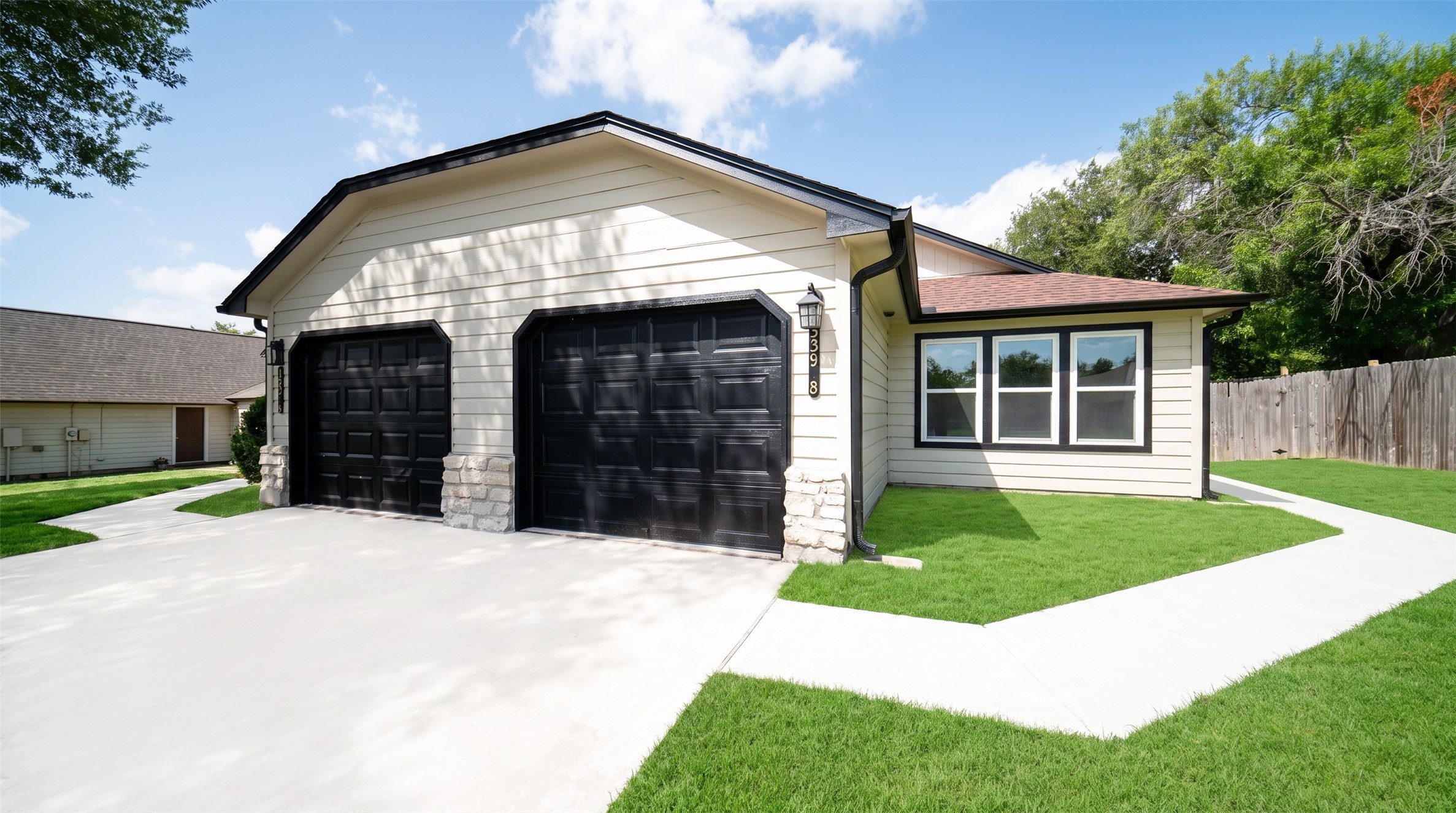 339 Fantail Loop, Unit B Austin, TX 78734 - Photo 3 of 21 a front view of a house with a yard and garage