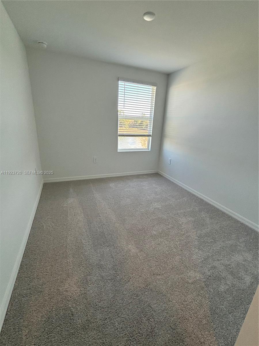 17459 Monte Isola Way Fort Myers, FL 33917 - Photo 14 of 24 an empty room with a window