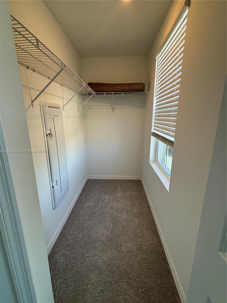 17459 Monte Isola Way Fort Myers, FL 33917 - Photo 19 of 24 a view of a room with a wooden floor and white walls