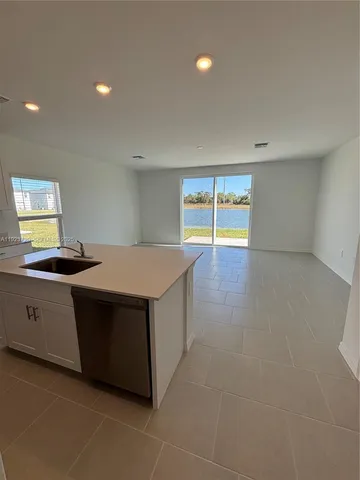 a kitchen with stainless steel appliances a stove and a refrigerator