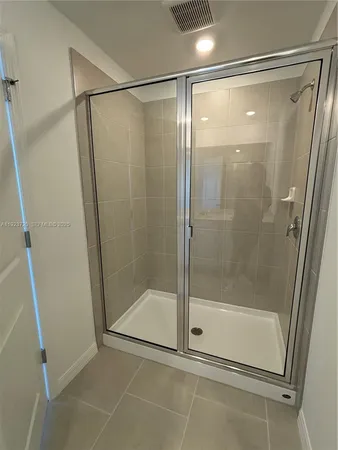 a white toilet sitting next to a sink