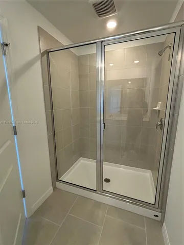 a white toilet sitting next to a sink